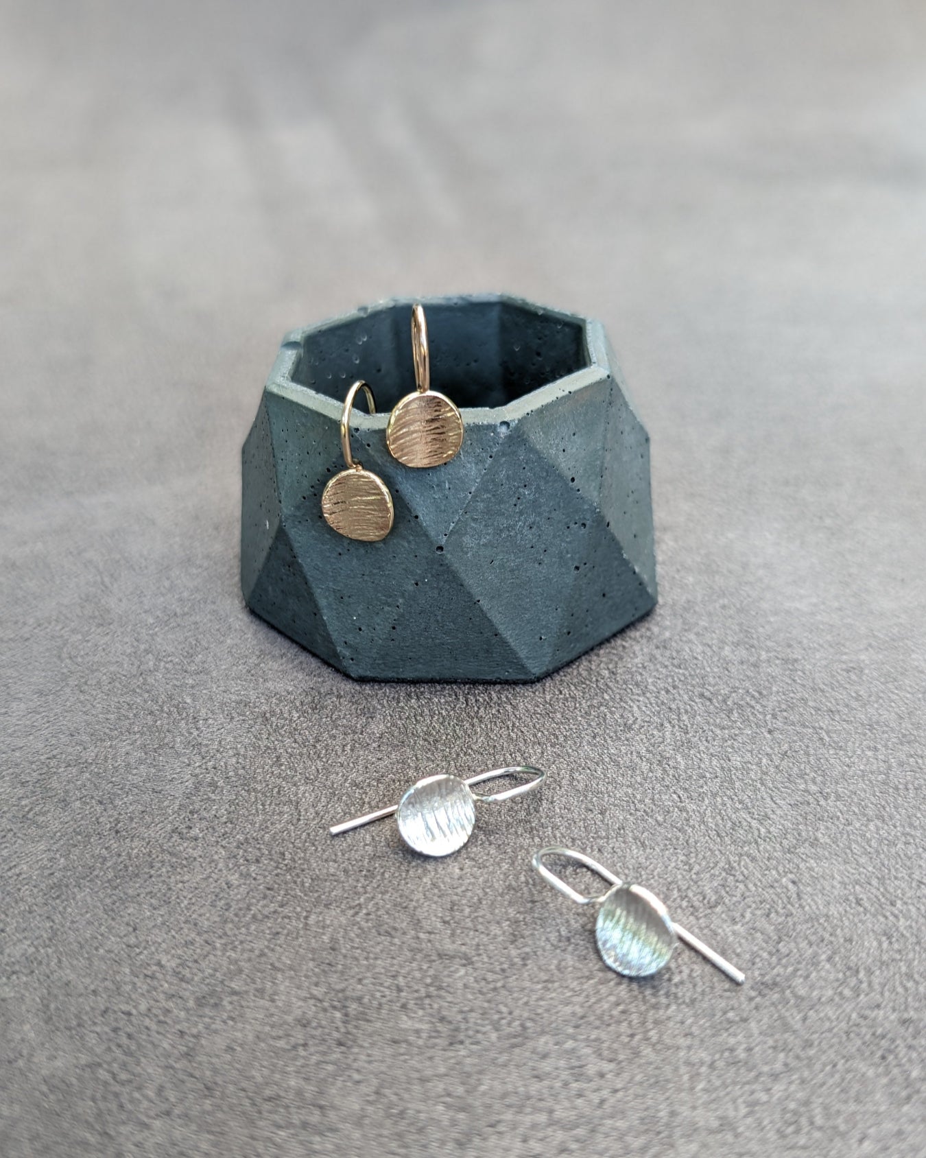 two pairs of textured disk earrings in 14k gold and silver