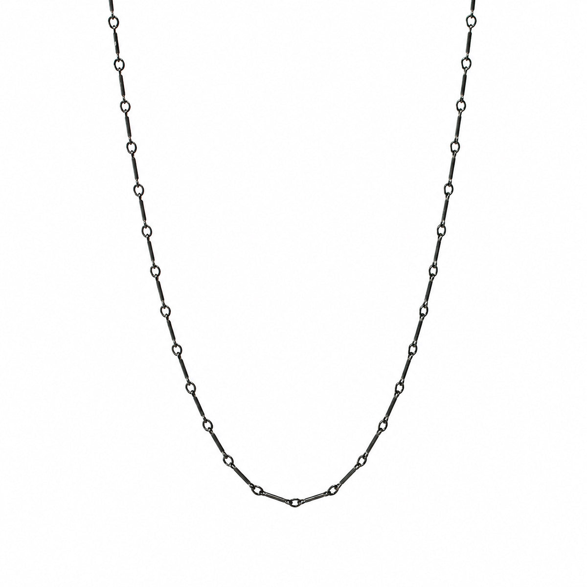 A delicate black chain necklace with small, evenly spaced open circle links, displayed in a U-shape against a solid white background.