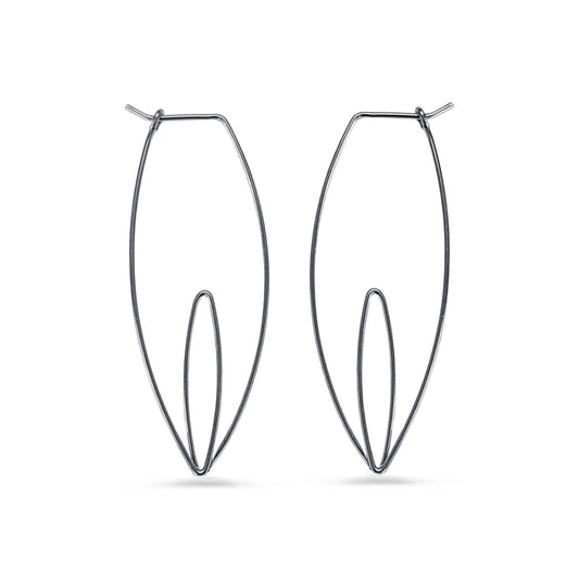 Pair of black wire hoop earrings on a white background