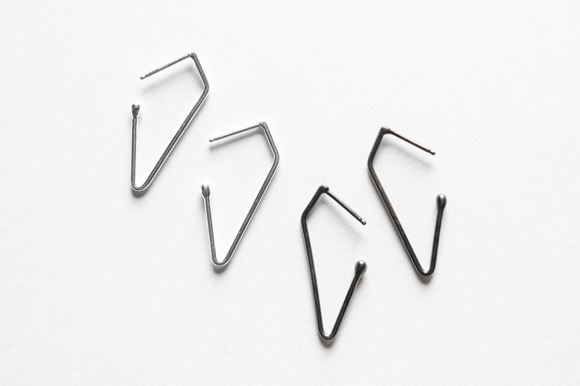 charcoal and bright silver charm hoops
