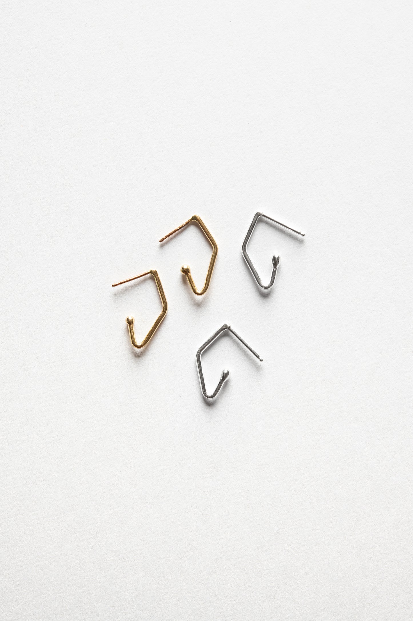 gold and silver mini v-shaped charm hoop earrings