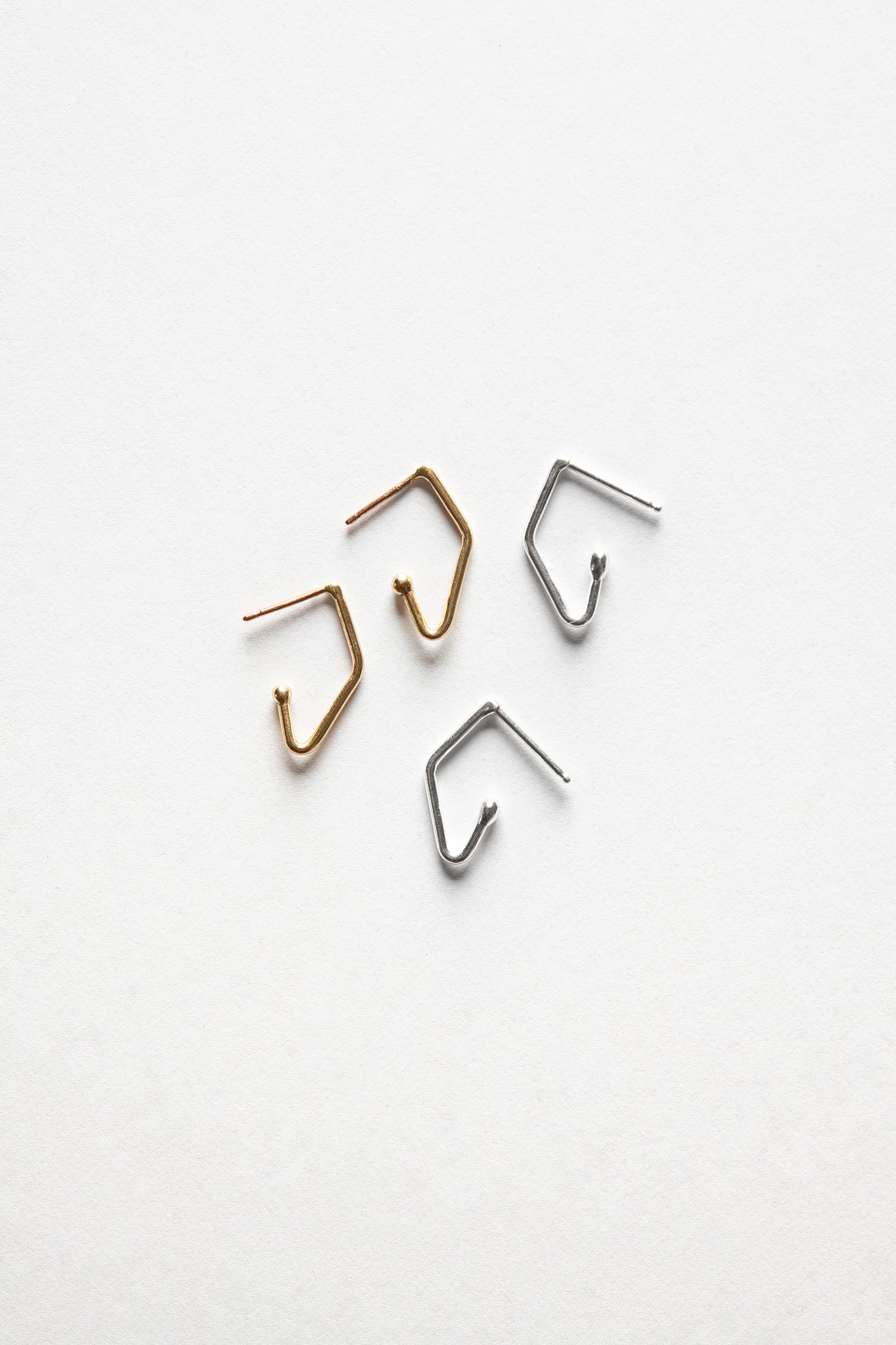 gold and silver mini v-shaped charm hoop earrings