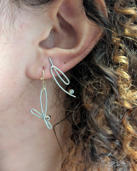 Model wearing earring stack