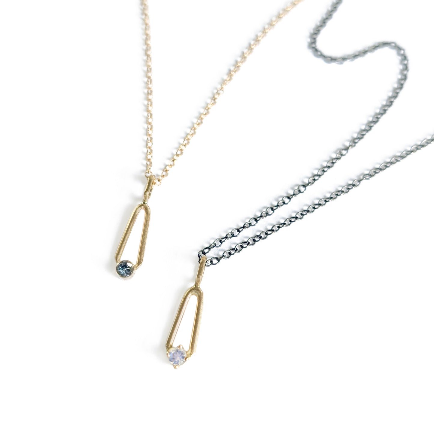 14K Gold Sapphire and moonstone teardrop charm pendants on charcoal and gold chains