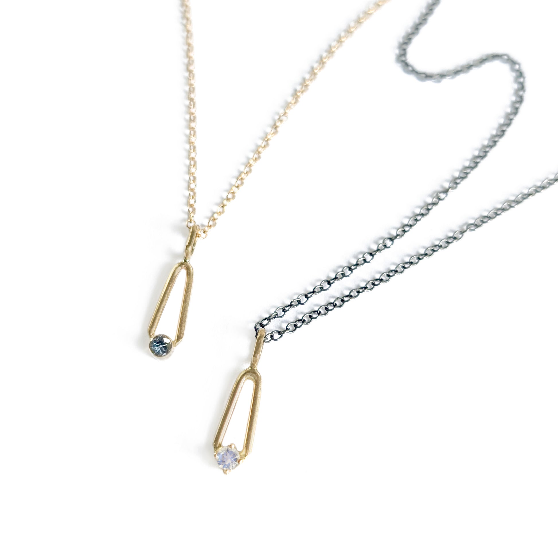 14K Gold Sapphire and moonstone teardrop charm pendants on charcoal and gold chains