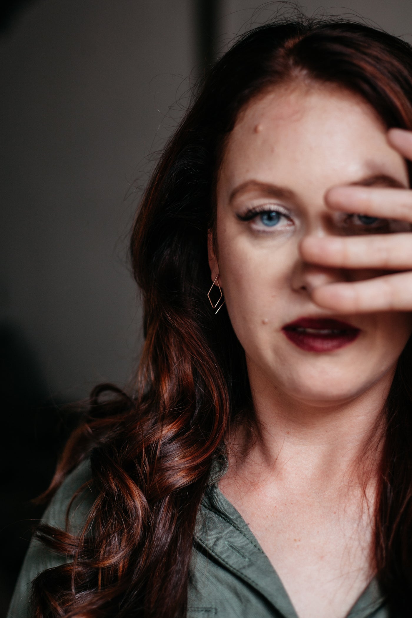 model wearing gold open diamond hoop earrings