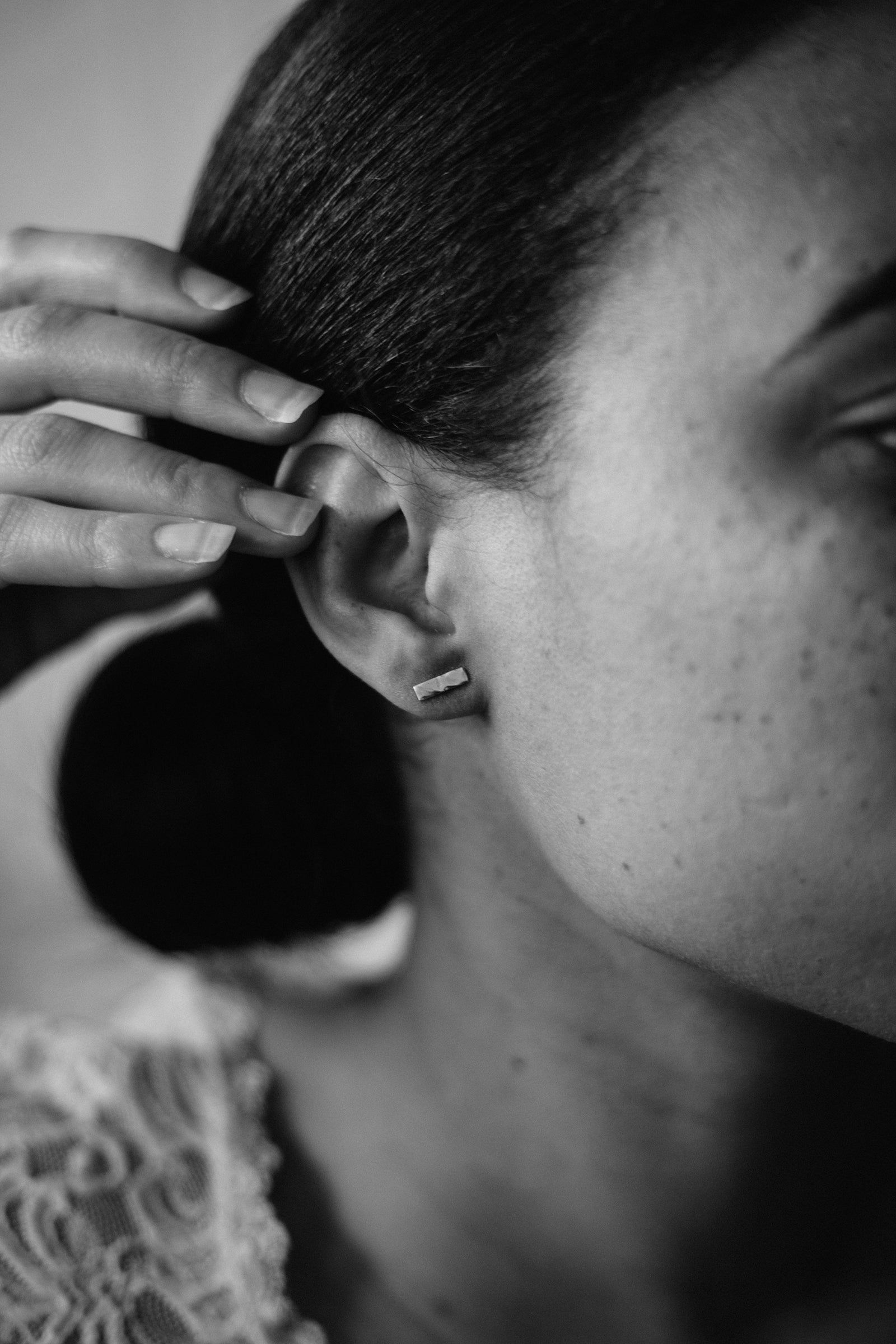 textured silver rectangle bar studs on model