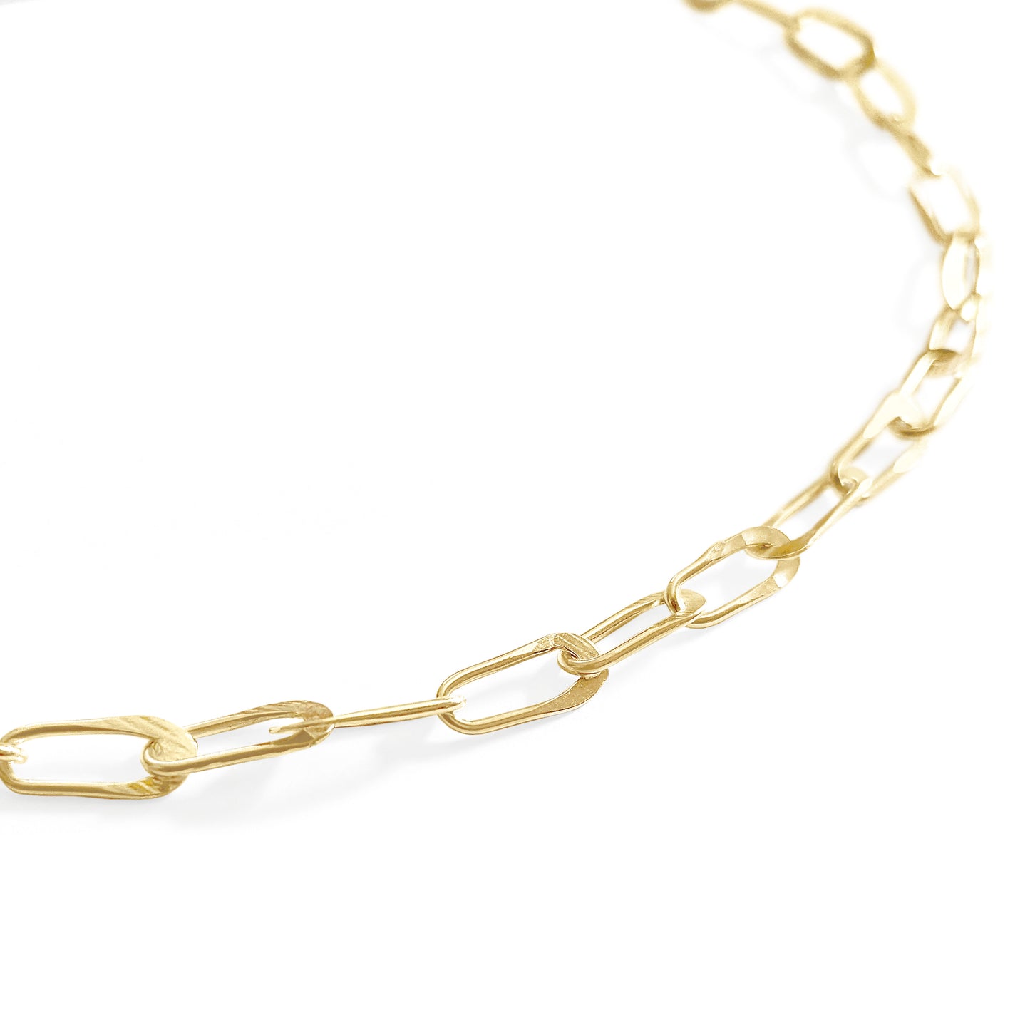 Gold chain necklace on a white background