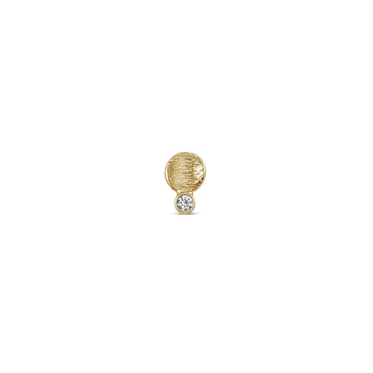 single small textured gold disk stud with a diamond