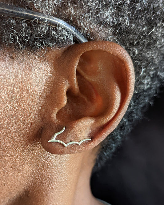 spiderweb ear climbers styled by model