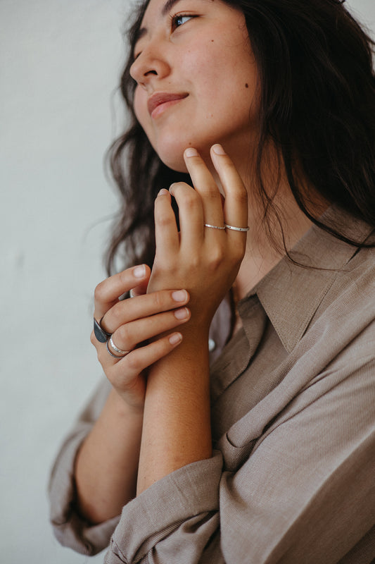 dotted silver slim stackable ring styled on model