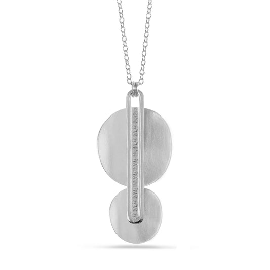 two stacked silver disks with elongated oval pendant necklace on silver chain