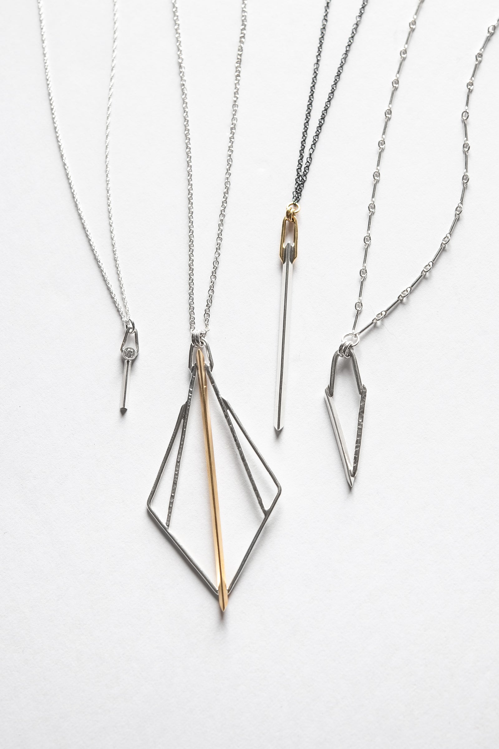 silver and gold Knife edge inspired pendant collection