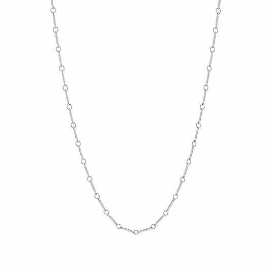 A delicate silver chain necklace with repeating small oval links, displayed against a plain white background.