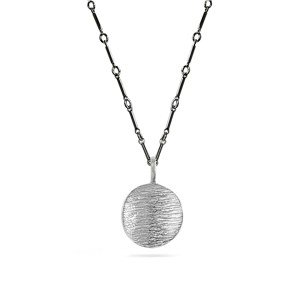silver linen-textured disk charm on charcoal bar chain necklace