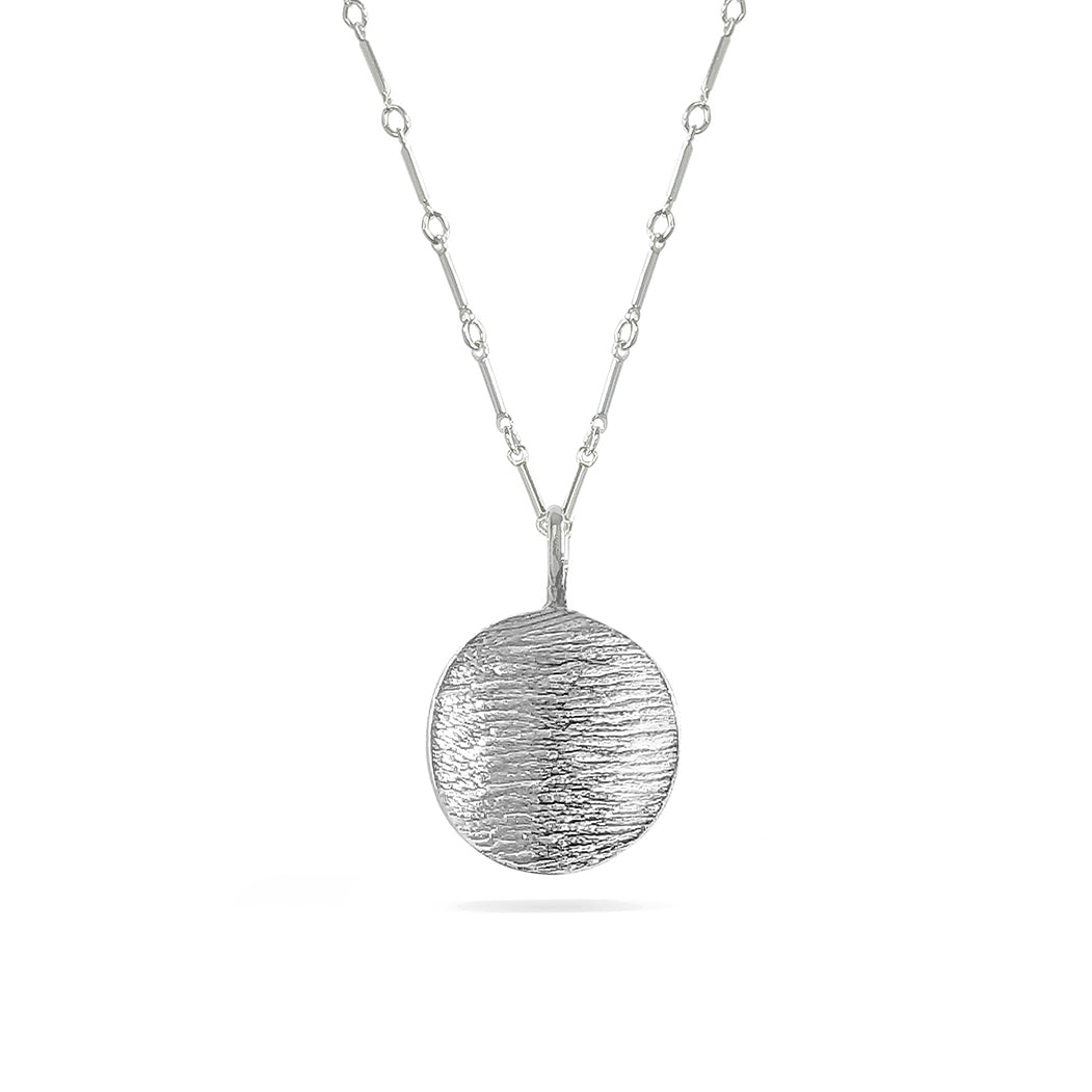 silver linen-textured disk charm on silver bar chain necklace