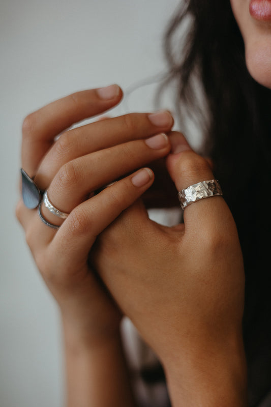 Hammered thick ring styled with other silver stacking rings