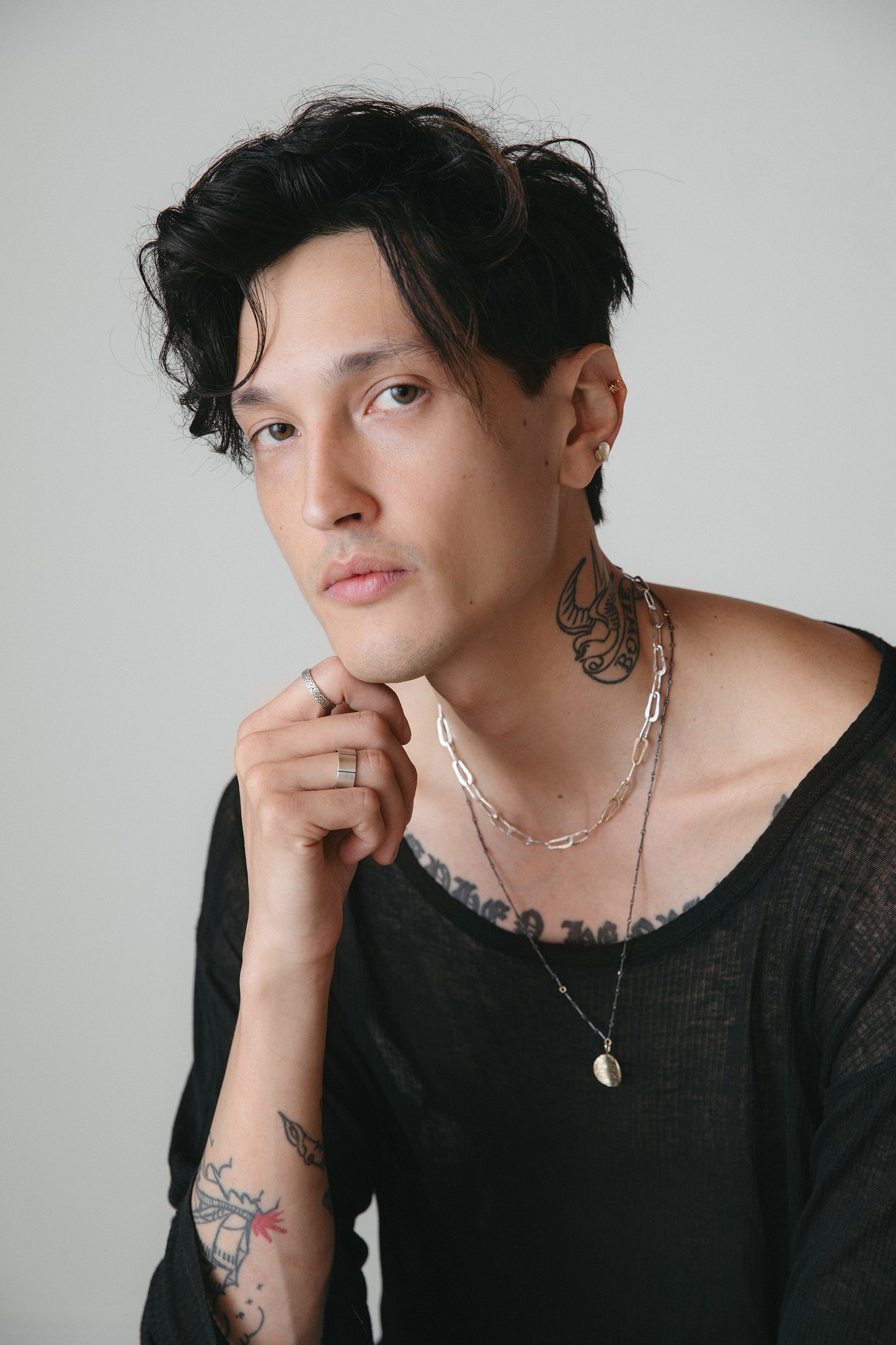 Model wearing silver hammered oval chain link necklace