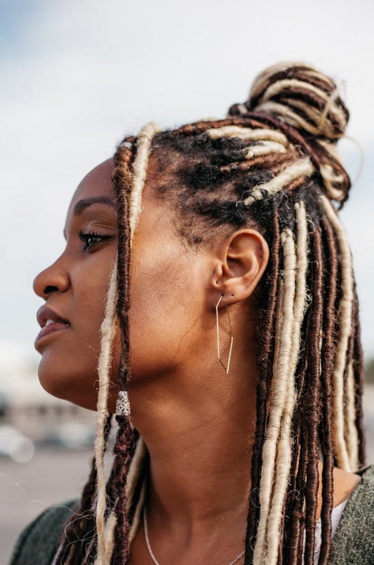 Large hexagonal textured hoop earrings styled on model