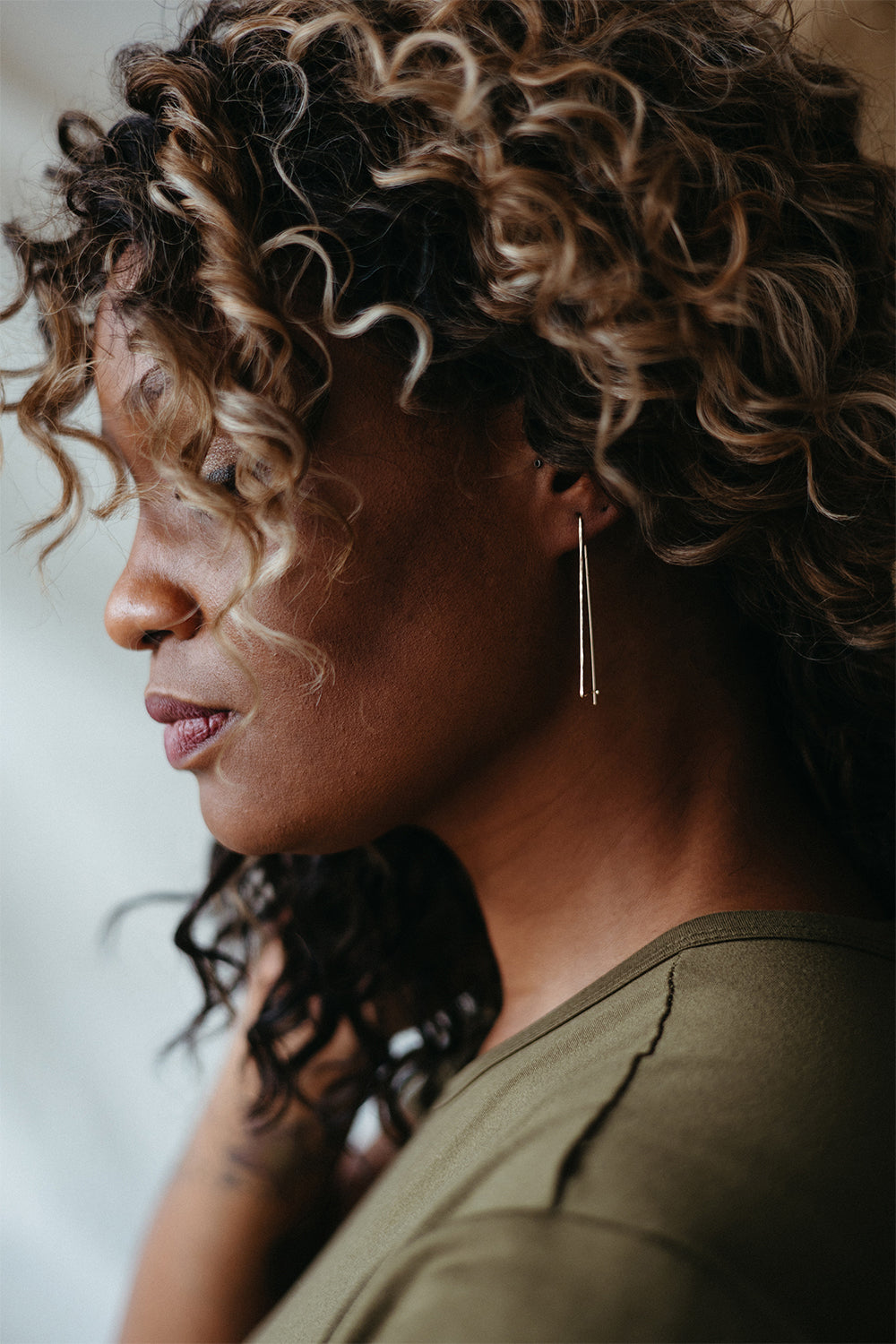 Everyday fine gold wire hoops styled on model