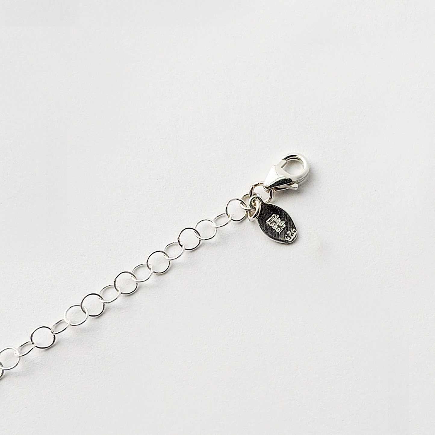 Chain extender with lobster clasp and charm in sterling silver