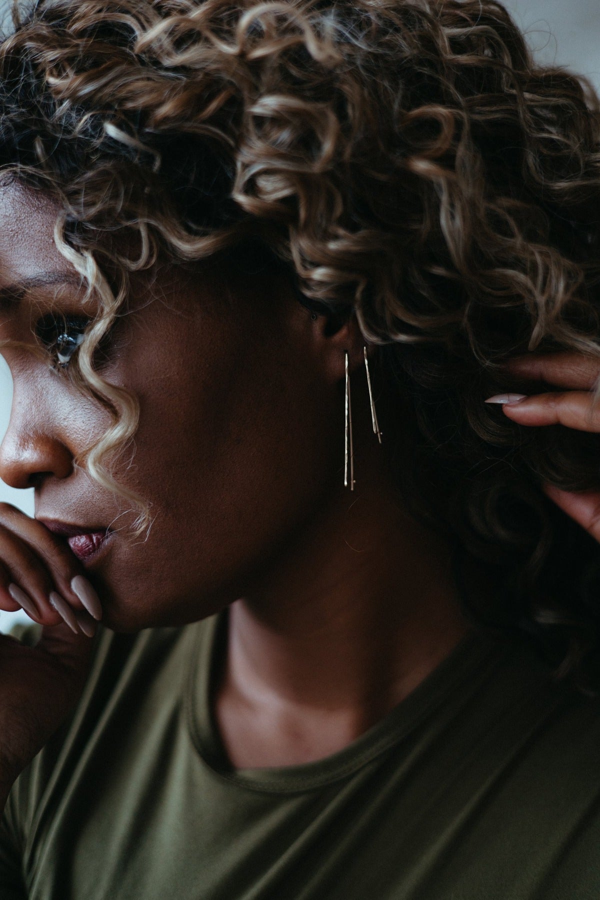 Double trapezoid wire hoop earrings stacked and styled on model