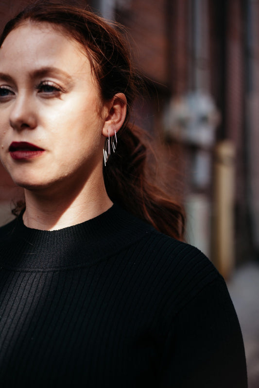 Silver delicate diamond spiral threader hoops styled on model