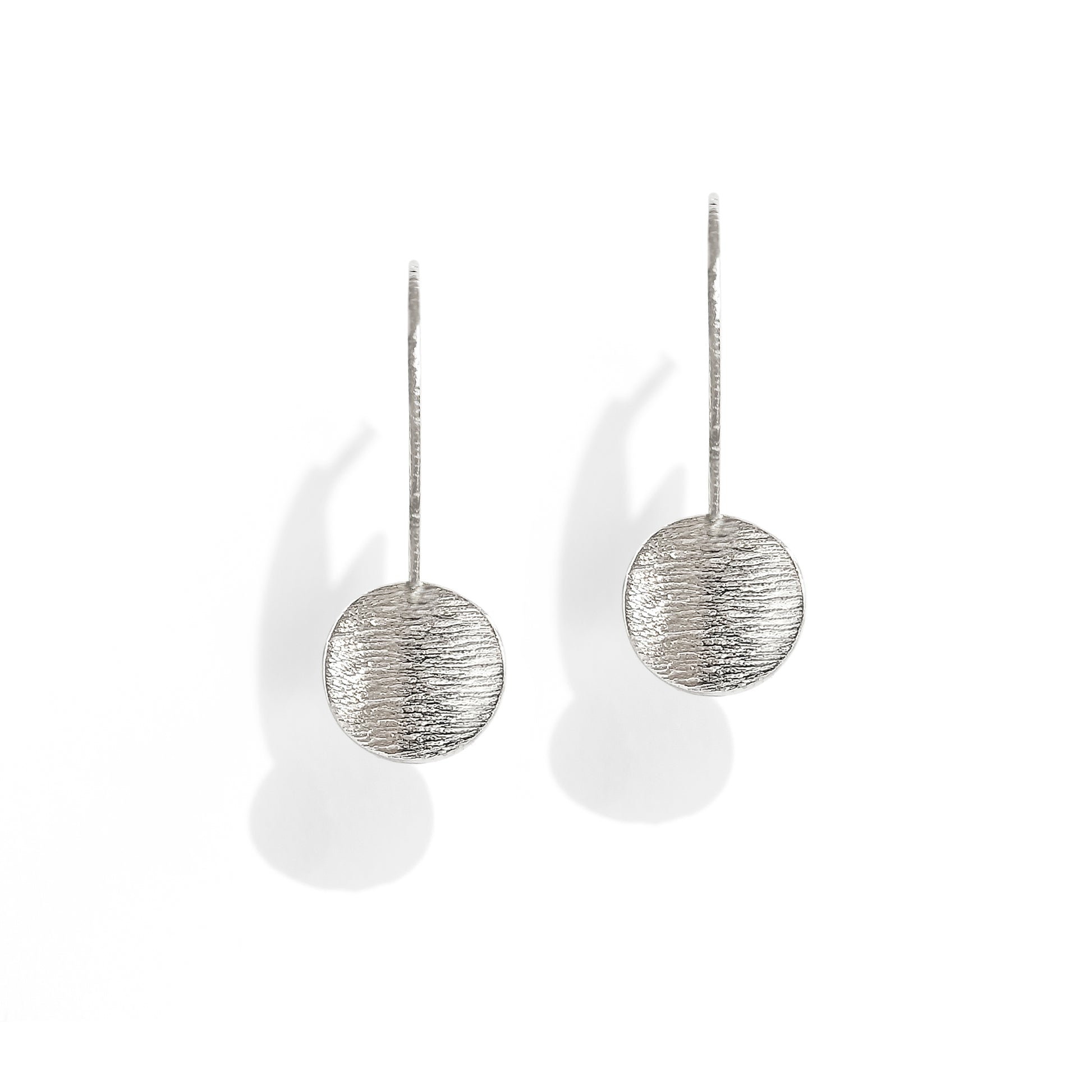 Textured silver drop disk stud earring front view