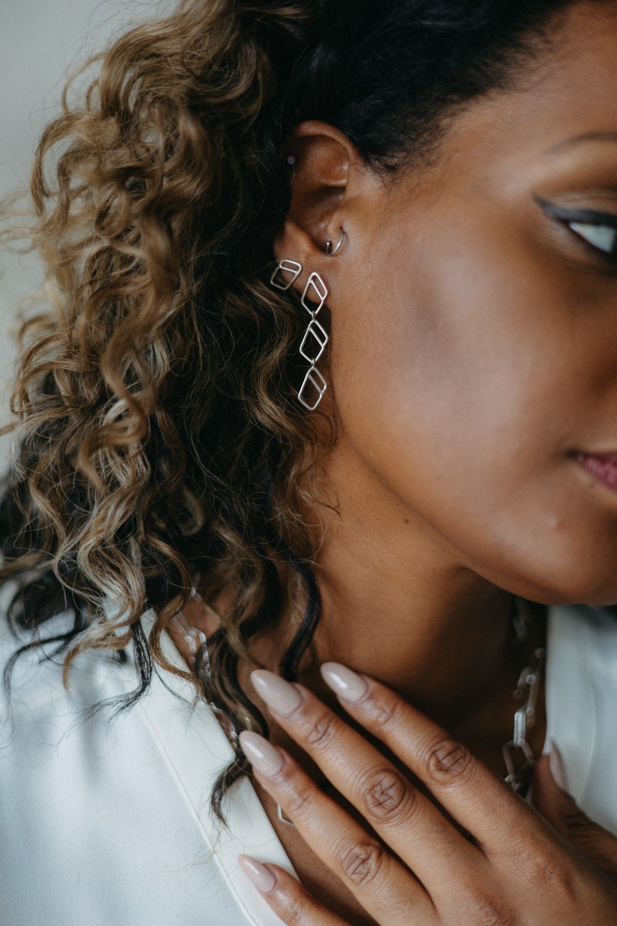 Open diamond stud earrings and diamond link earrings in silver