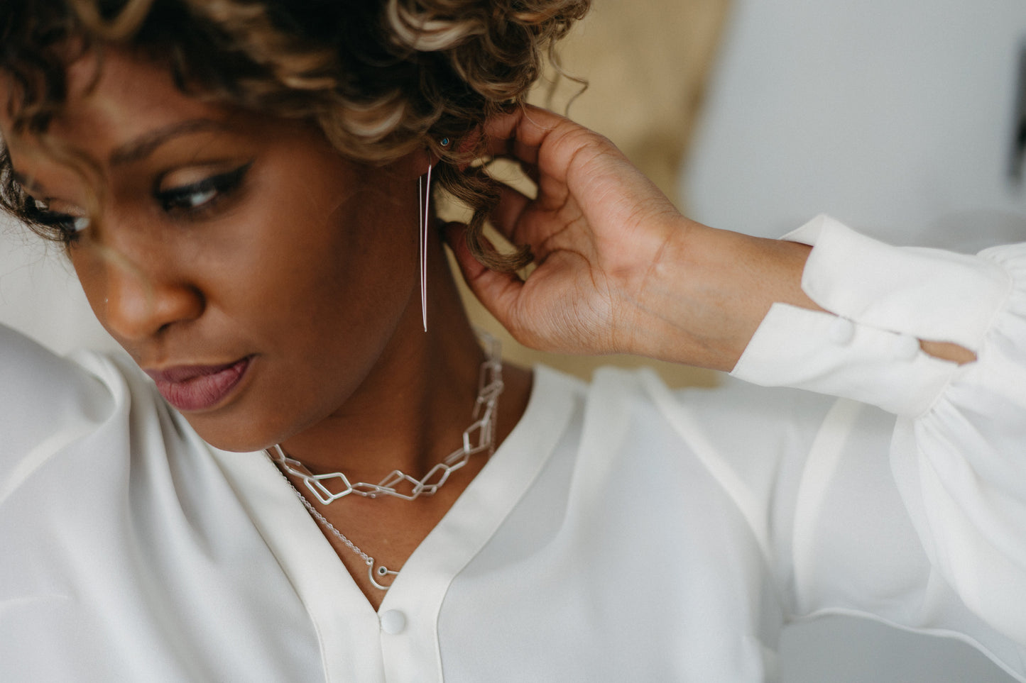 Model styled in silver open diamond chain necklace