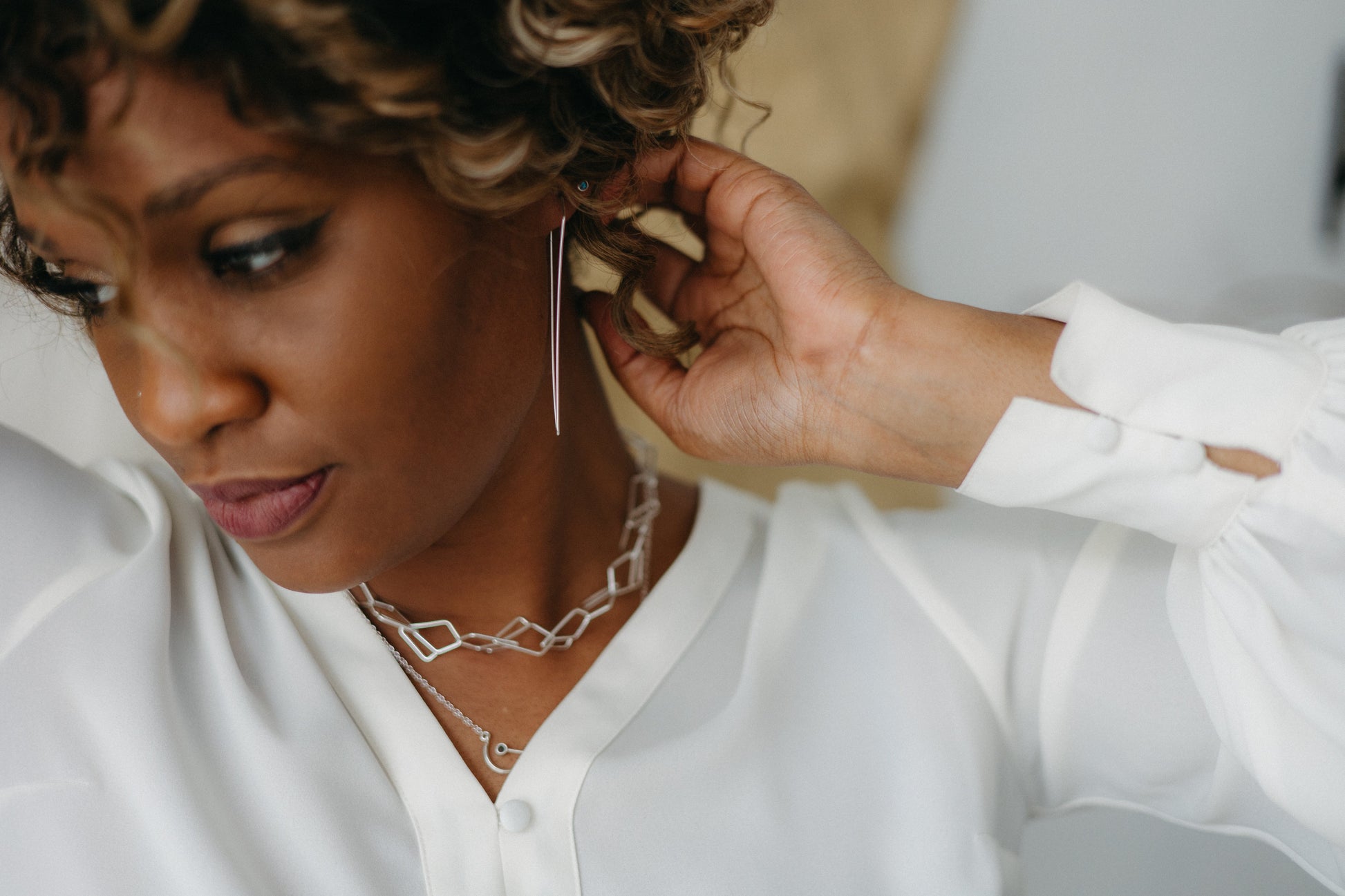 Model styled in silver open diamond chain necklace