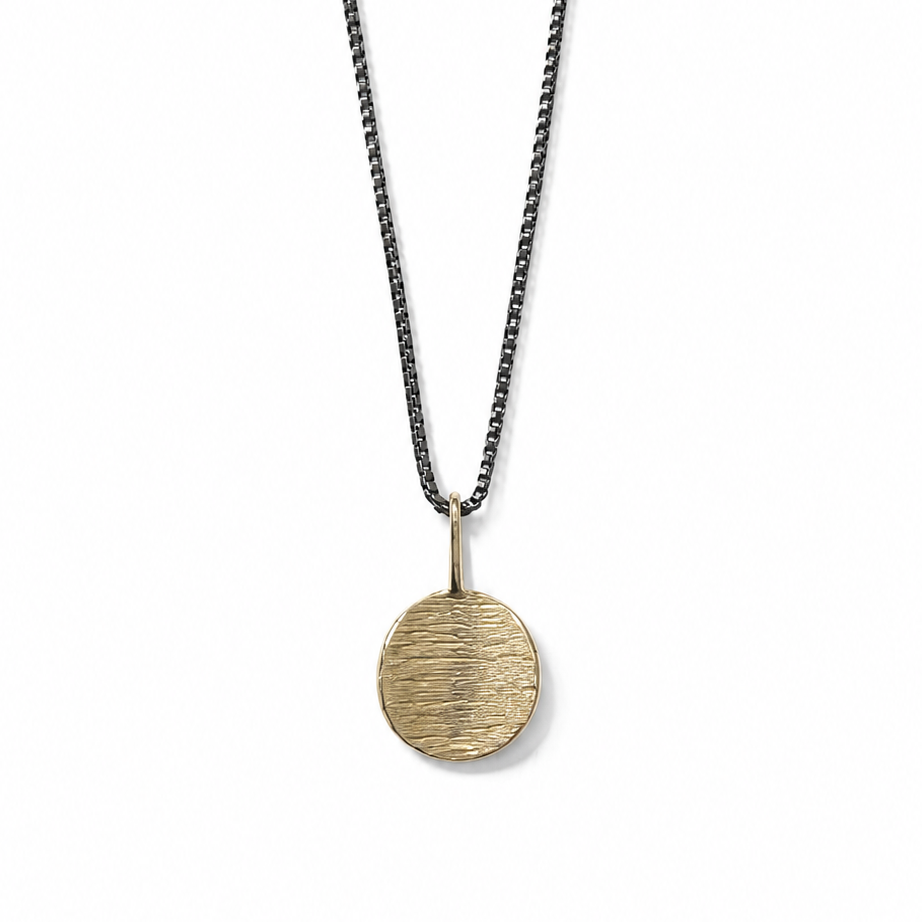 Necklace with a round pendant on a white background