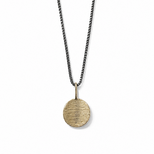 Necklace with a round pendant on a white background