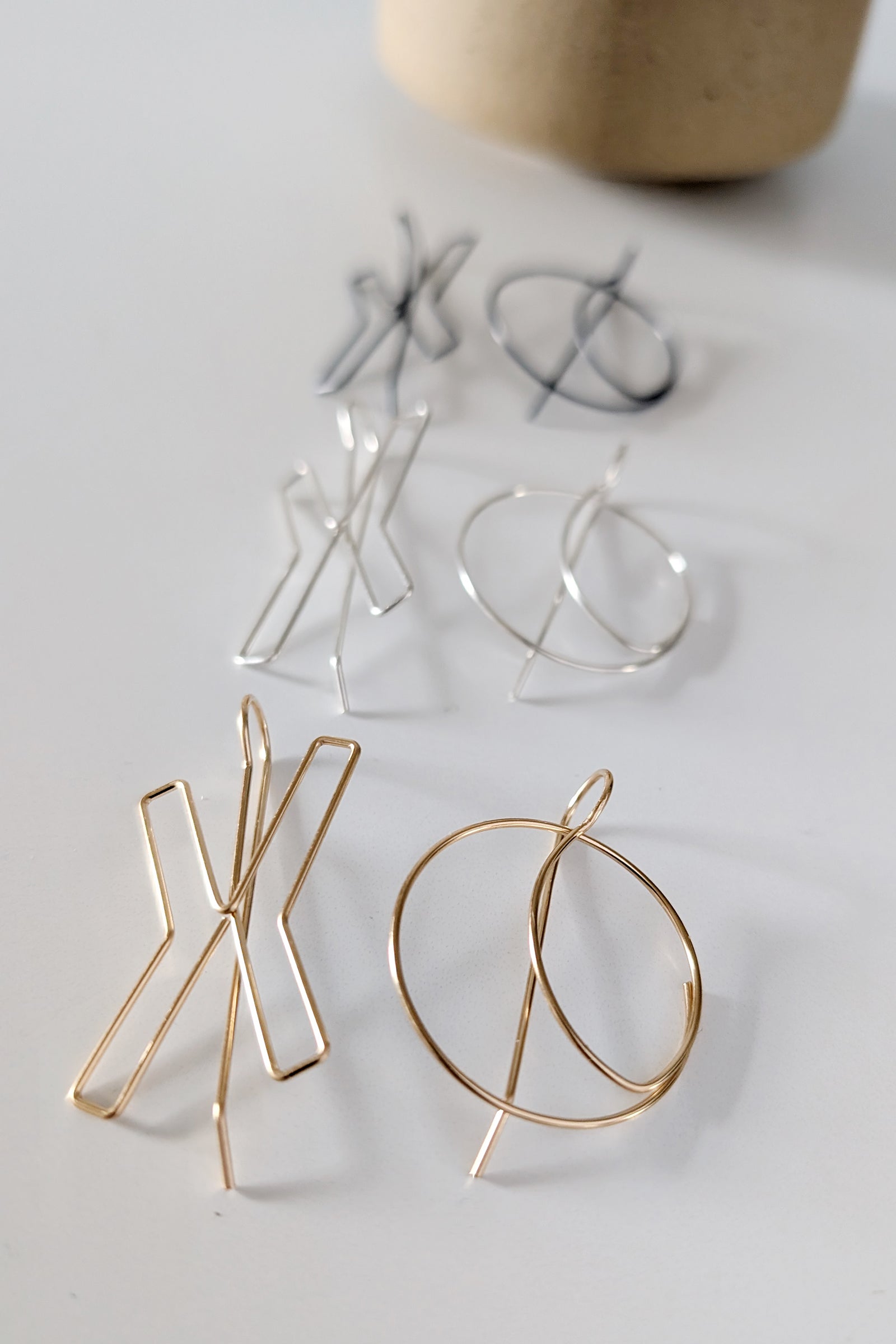 Gold, silver and black XO threader hoop earrings