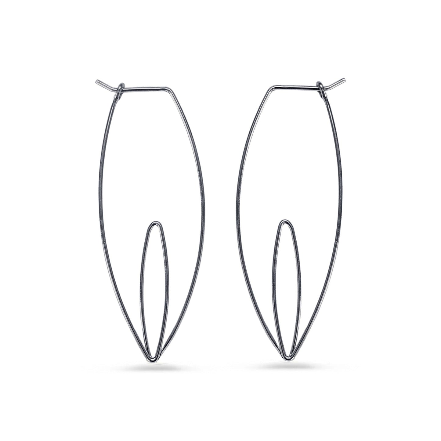 Pair of black wire hoop earrings on a white background