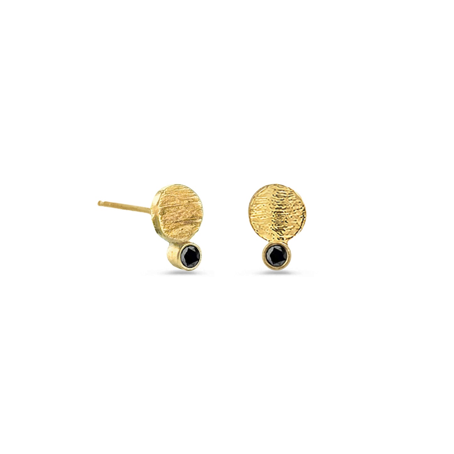 A pair of gold stud earrings with a textured disc and a small black diamond on white background.