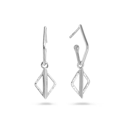 A pair of silver geometric drop earrings with a textured diamond-shaped pendant and a curved hook back, shown on a clean white background.