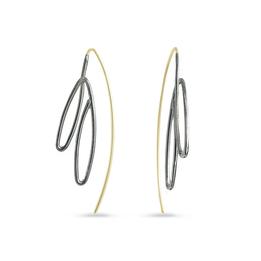 Pair of gold and silver hoop earrings on a white background