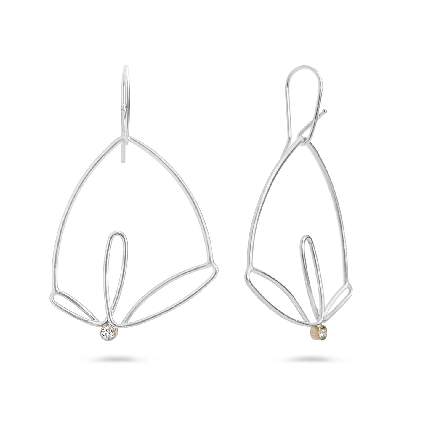 Pair of silver leaf-shaped earrings on a white background