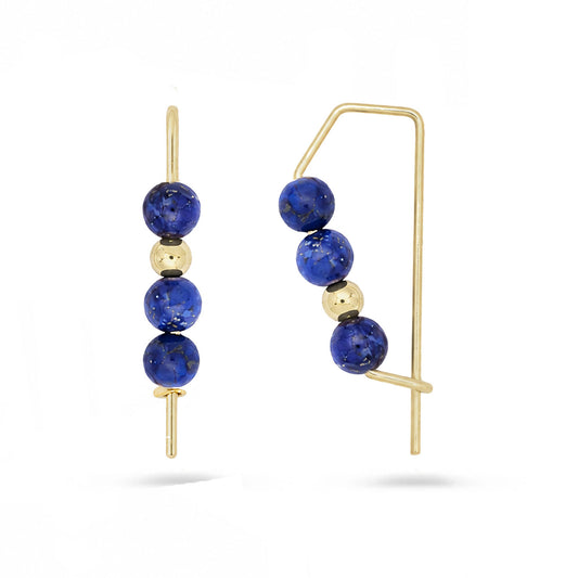 Gold hoops with stacked lapis blue gemstone beads on white background