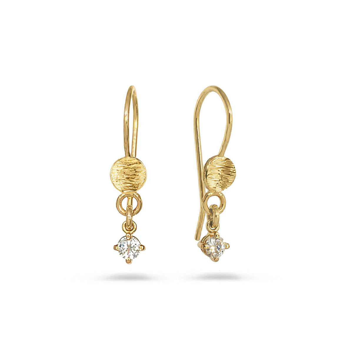 Pair of gold drop earrings with clear round-cut gemstone dangling at the bottom, on white background.