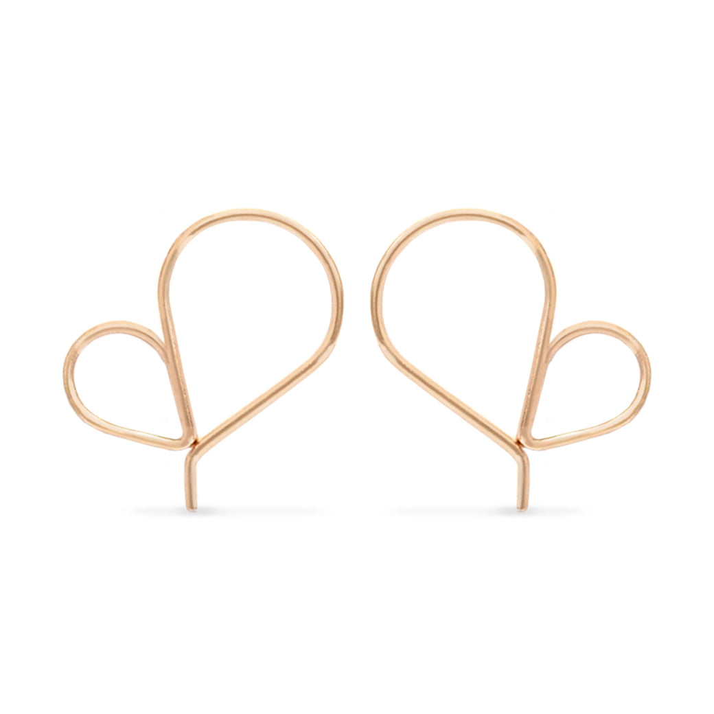 Pair of rose gold heart-shaped earrings on a white background