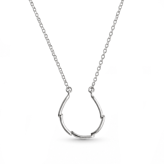 A silver chain necklace featuring a minimalist, open U-shaped shaped pendant in sterling silver shown against a plain white background.