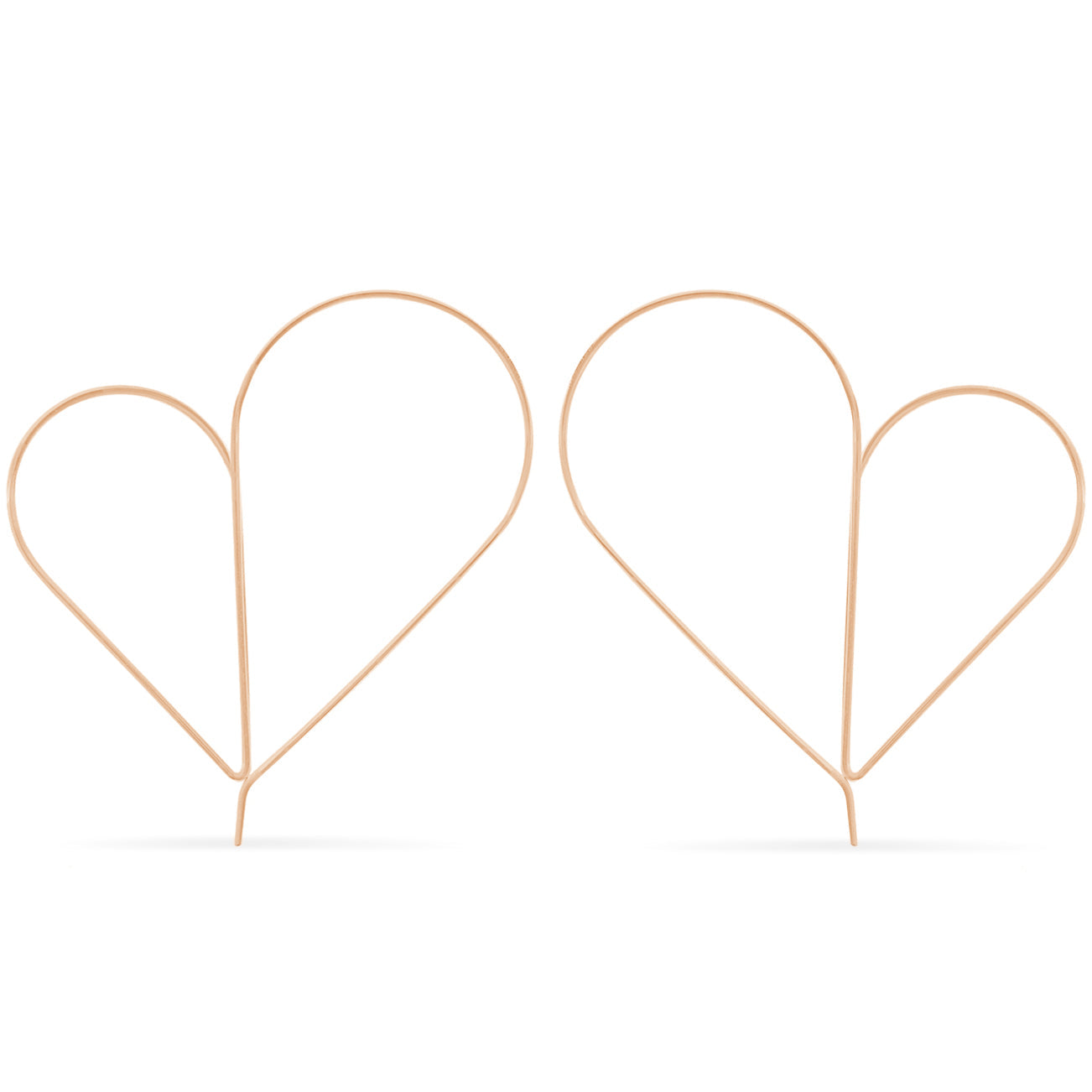 Two rose gold heart-shaped hair accessories on a white background