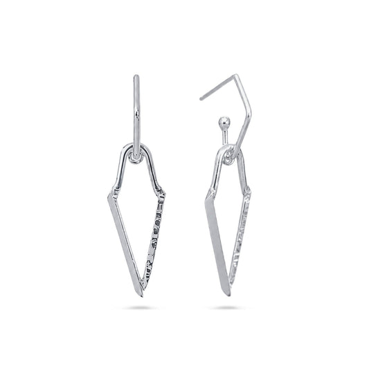 A pair of silver drop earrings with a geometric, openwork chevron or arrow-like design, shown against a plain white background.