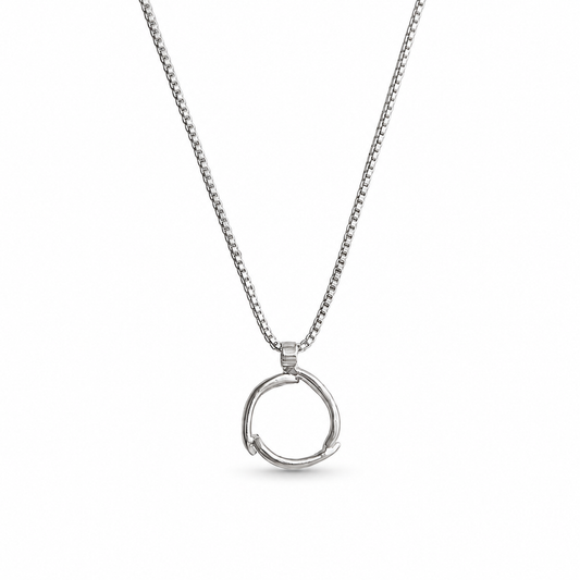 A silver necklace featuring a delicate box chain and a polished, open circular pendant, displayed against a clean white background.
