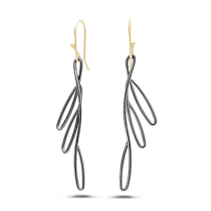 Pair of black bird of paradise flower-inspired earrings with 14K gold hooks on a white background