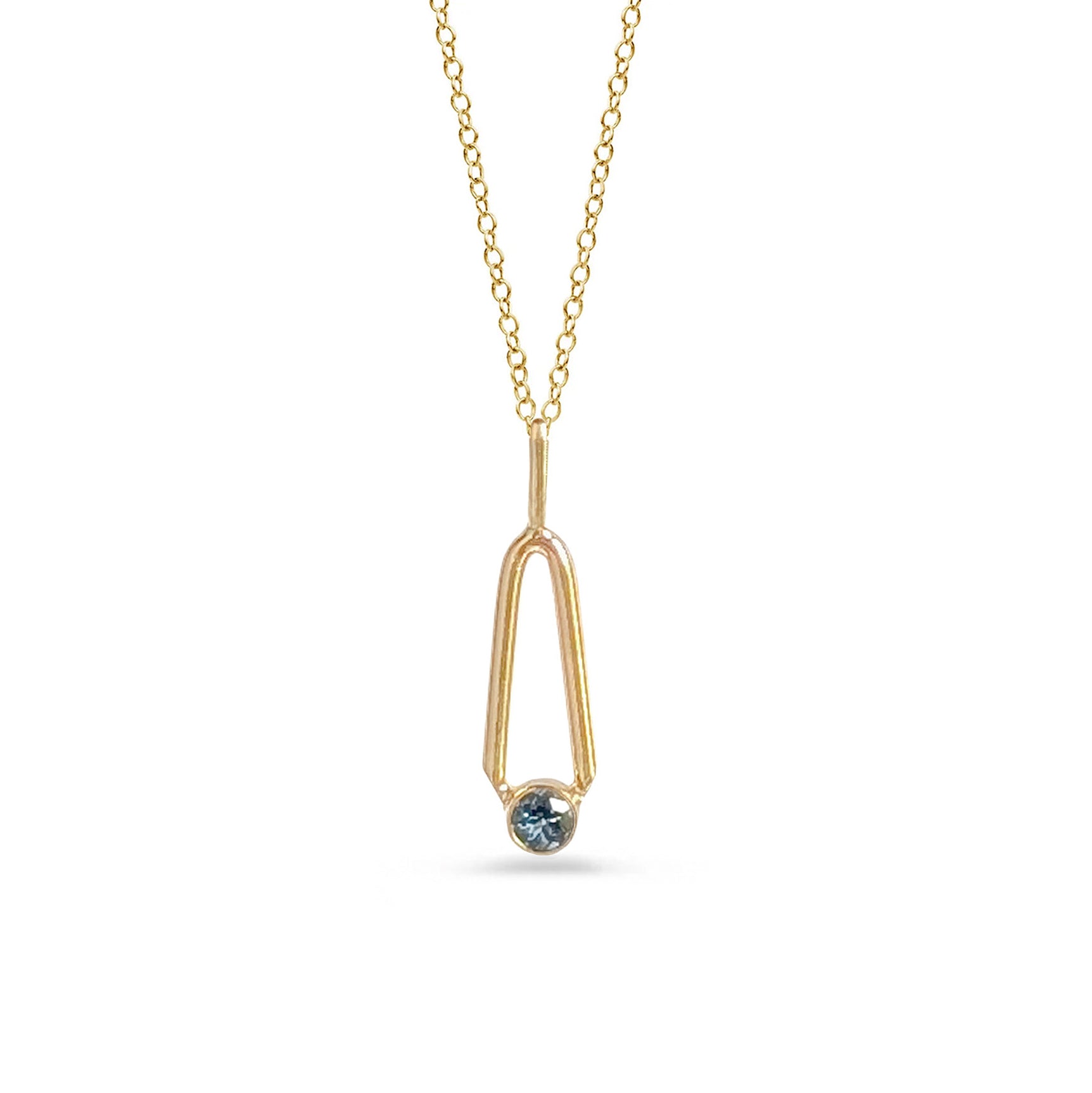 Gold necklace with a blue gemstone pendant on a white background