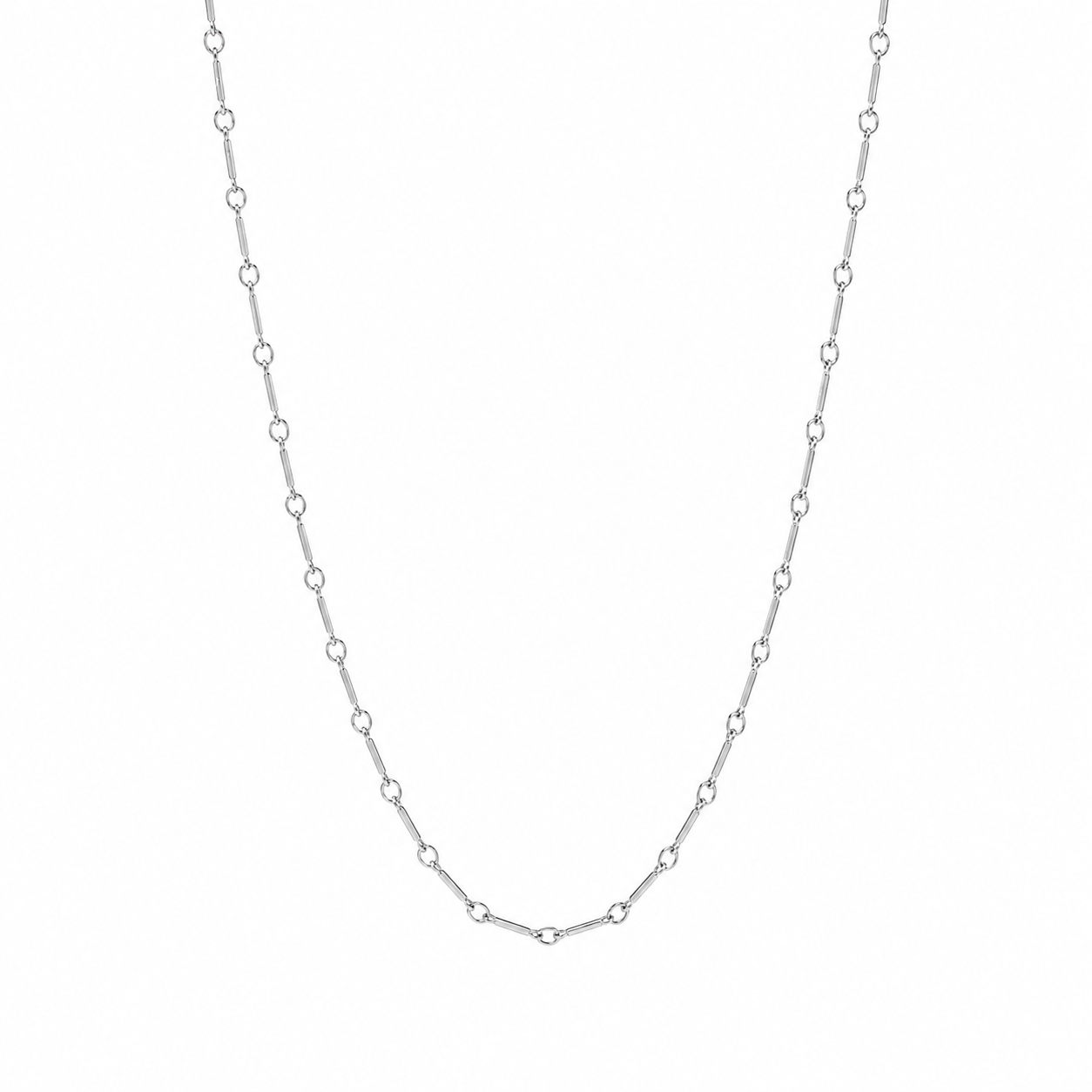A delicate silver chain necklace with repeating small oval links, displayed against a plain white background.