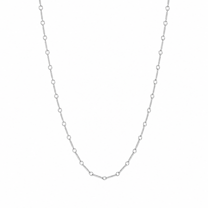 A delicate silver chain necklace with repeating small oval links, displayed against a plain white background.